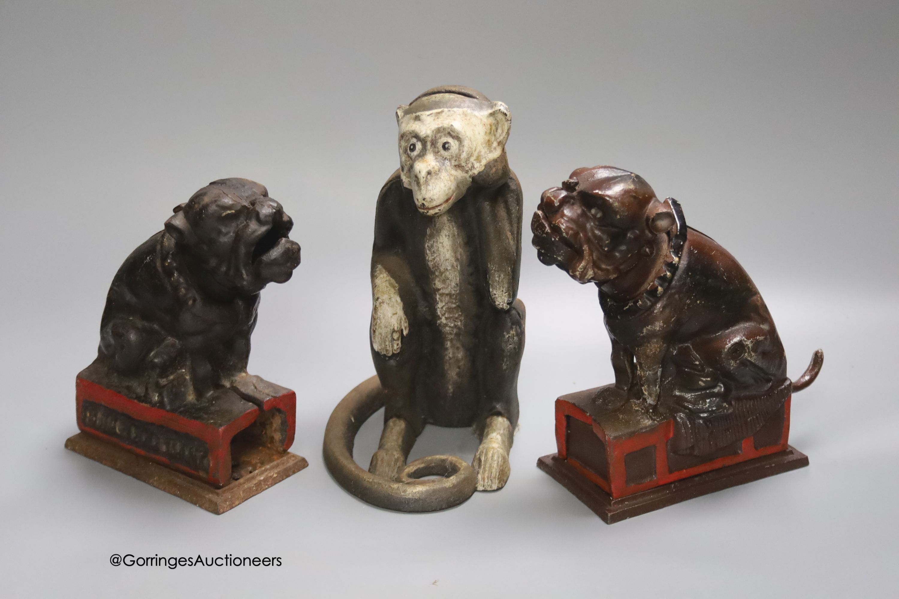 Two cast iron Bull Dog Banks, 16cm, and a cast iron monkey bank